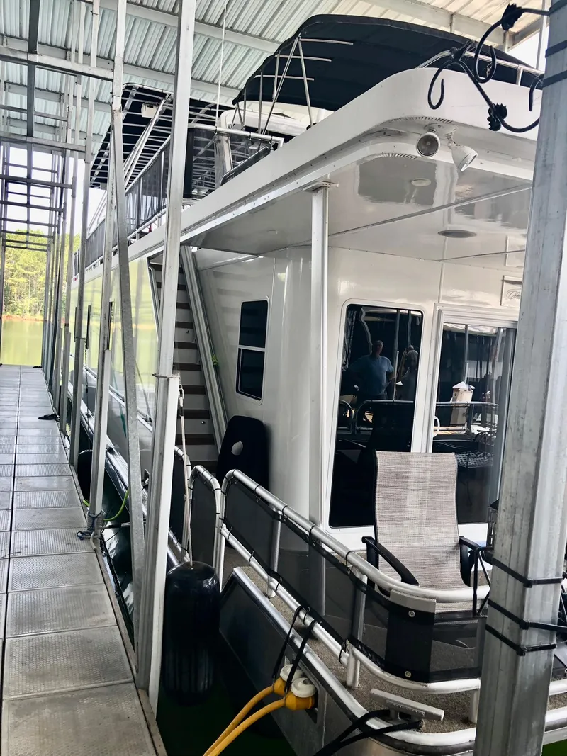 Slide: The Image of 2016 Thoroughbred 67x17 houseboat docked in a covered marina. - 5