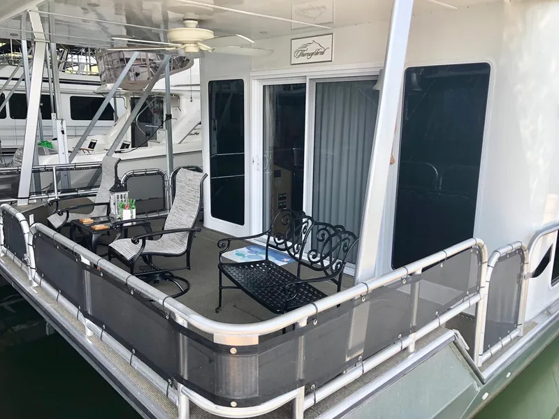 Slide: The Image of 2016 Thoroughbred 67x17 houseboat with outdoor seating area. - 6