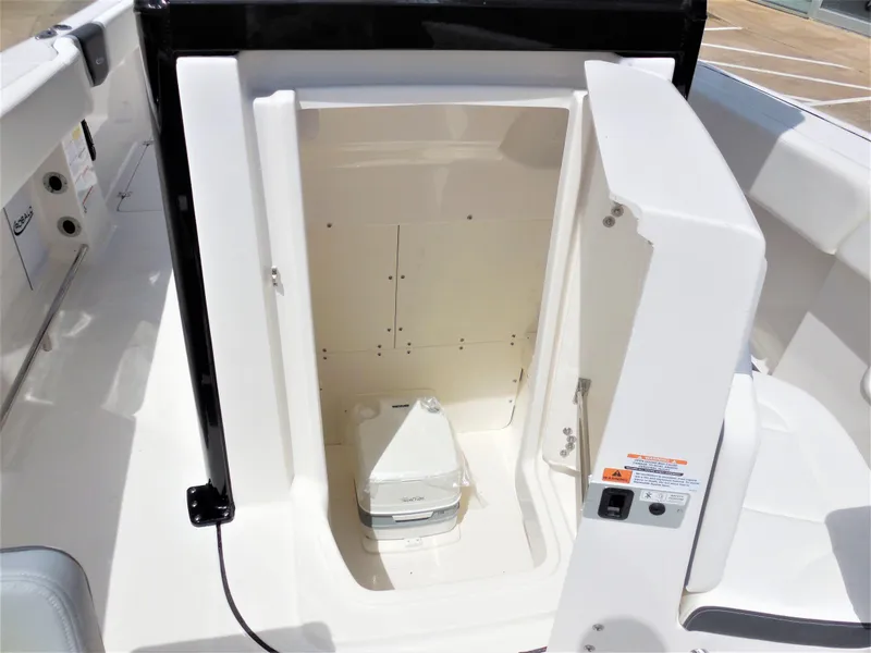 Slide: The Image of 2023 Robalo R250 boat interior with open storage compartment. - 10
