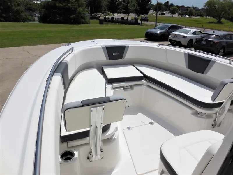 Slide: The Image of 2023 Robalo R250 boat interior with white and gray seating. - 12