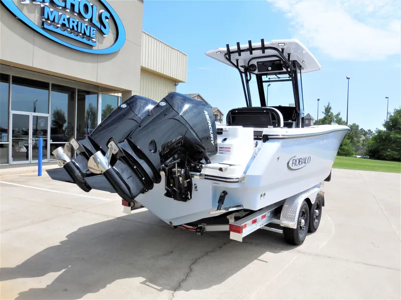 Slide: The Image of 2023 Robalo R250 boat with dual outboard engines on a trailer at Nichols Marine. - 3