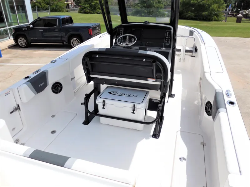 Slide: The Image of 2023 Robalo R250 boat interior with seating and console. - 5