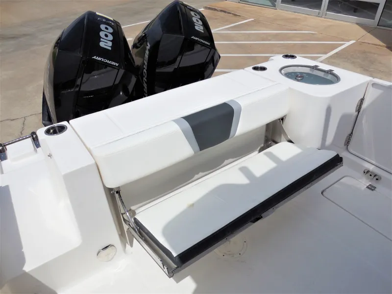 Slide: The Image of 2023 Robalo R250 boat with dual outboard engines and foldable rear bench seat. - 6