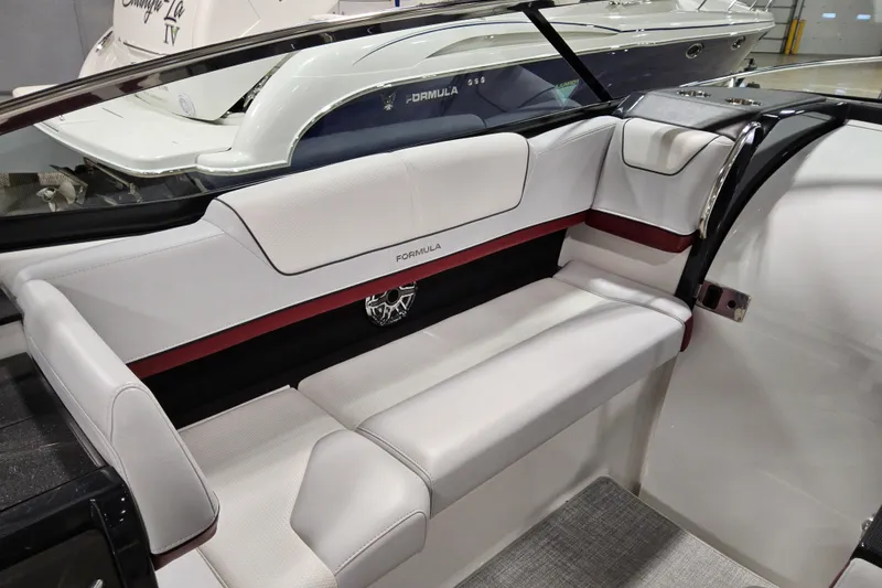 Slide: The Image of 2023 Formula 310 Sun Sport boat interior with sleek white seating and modern design. - 10