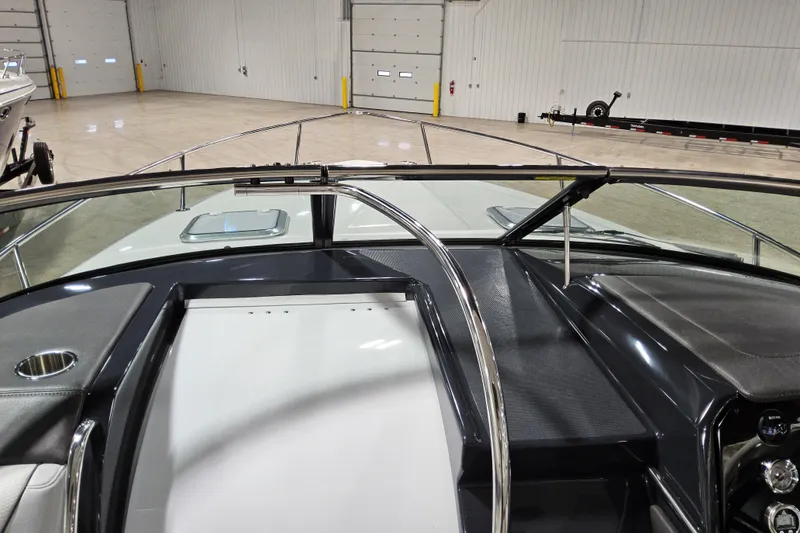 Slide: The Image of 2023 Formula 310 Sun Sport boat interior with sleek dashboard and windshield. - 11