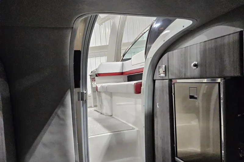 Slide: The Image of Interior view of 2023 Formula 310 Sun Sport boat, featuring sleek design and modern amenities. - 19