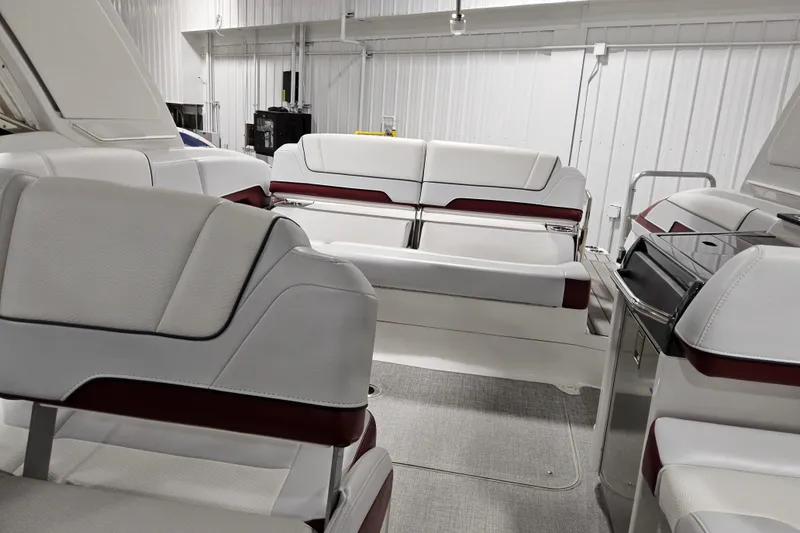 Slide: The Image of 2023 Formula 310 Sun Sport boat interior with luxurious white seating in a modern setting. - 21