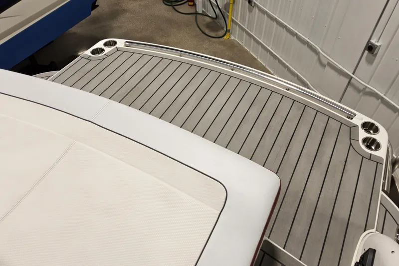 Slide: The Image of 2023 Formula 310 Sun Sport boat deck with sleek, modern design and cup holders. - 23
