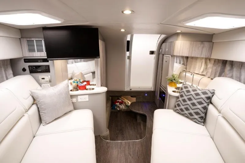 Slide: The Image of 2023 Formula 310 Sun Sport interior cabin with modern amenities and stylish decor. - 3