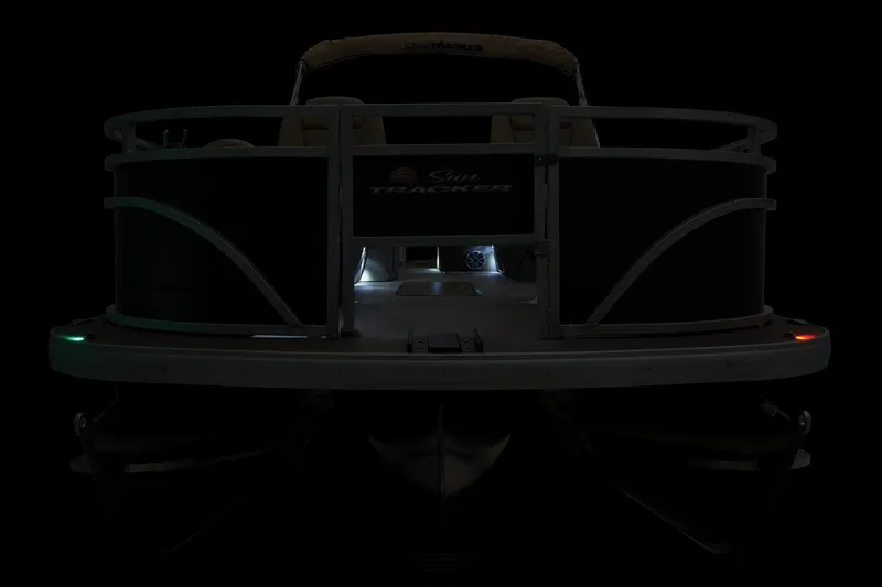 Slide: The Image of 2024 Sun Tracker Sportfish 24 XP3 pontoon boat, front view in low light. - 10