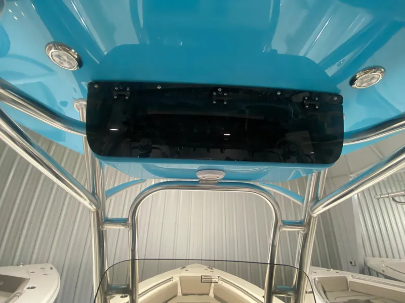 Slide: The Image of 2024 Key West 239 FS boat interior with blue canopy and stainless steel frame. - 13