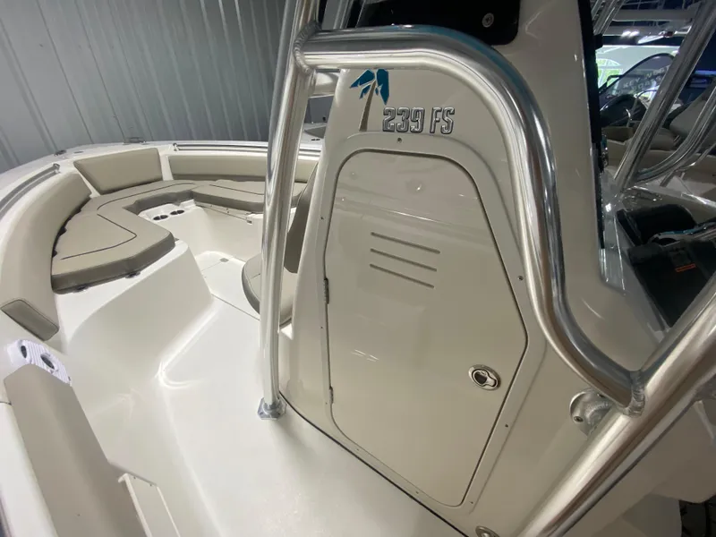 Slide: The Image of 2024 Key West 239 FS boat interior with seating and storage. - 21