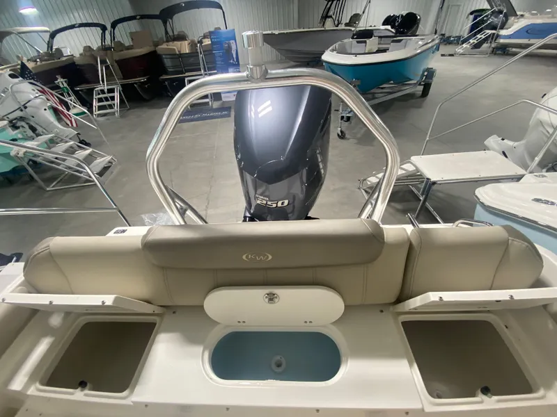 Slide: The Image of 2024 Key West 239 FS boat interior with Yamaha 250 engine in showroom. - 6