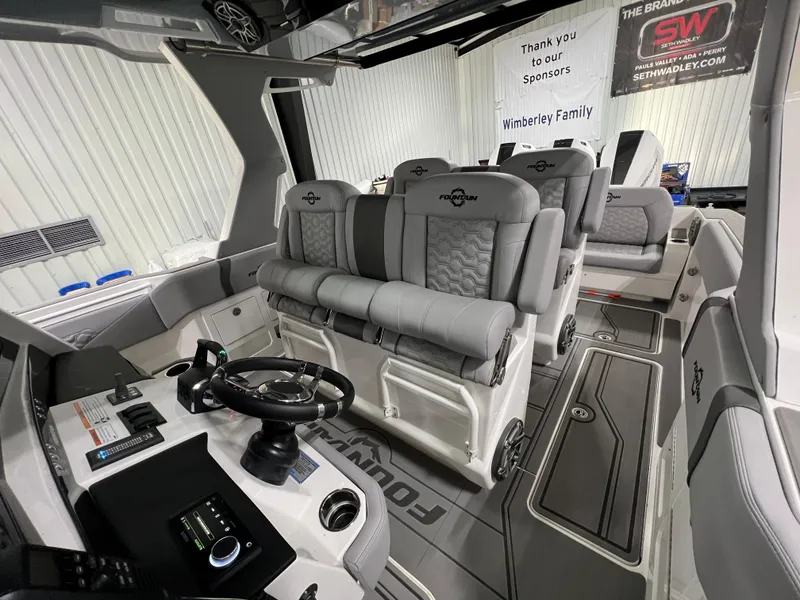 Slide: The Image of 2023 Fountain 38 SCX boat interior with modern seating and control panel. - 19