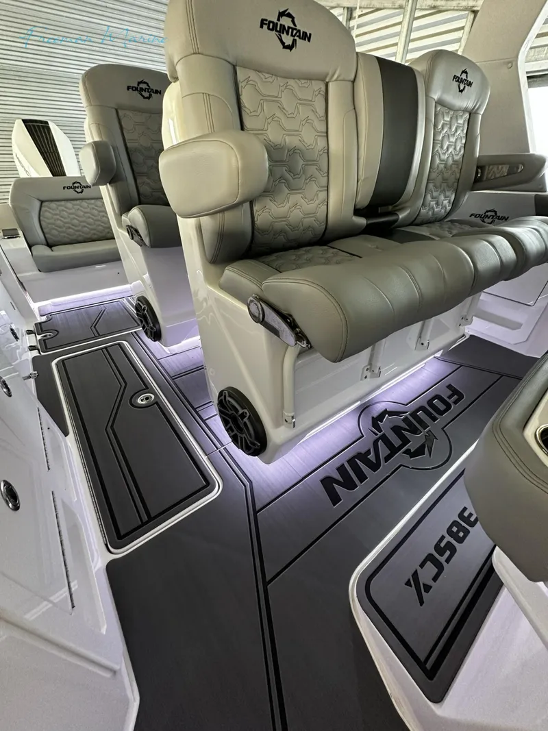 Slide: The Image of 2023 Fountain 38 SCX boat interior with luxurious seating and illuminated flooring. - 21