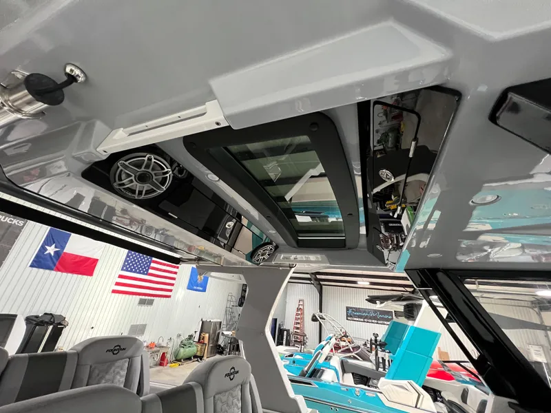 Slide: The Image of Interior view of 2023 Fountain 38 SCX boat with modern design and American flags. - 27