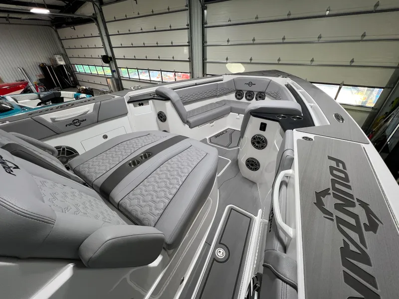 Slide: The Image of 2023 Fountain 38 SCX boat interior with sleek gray seating and modern design. - 29