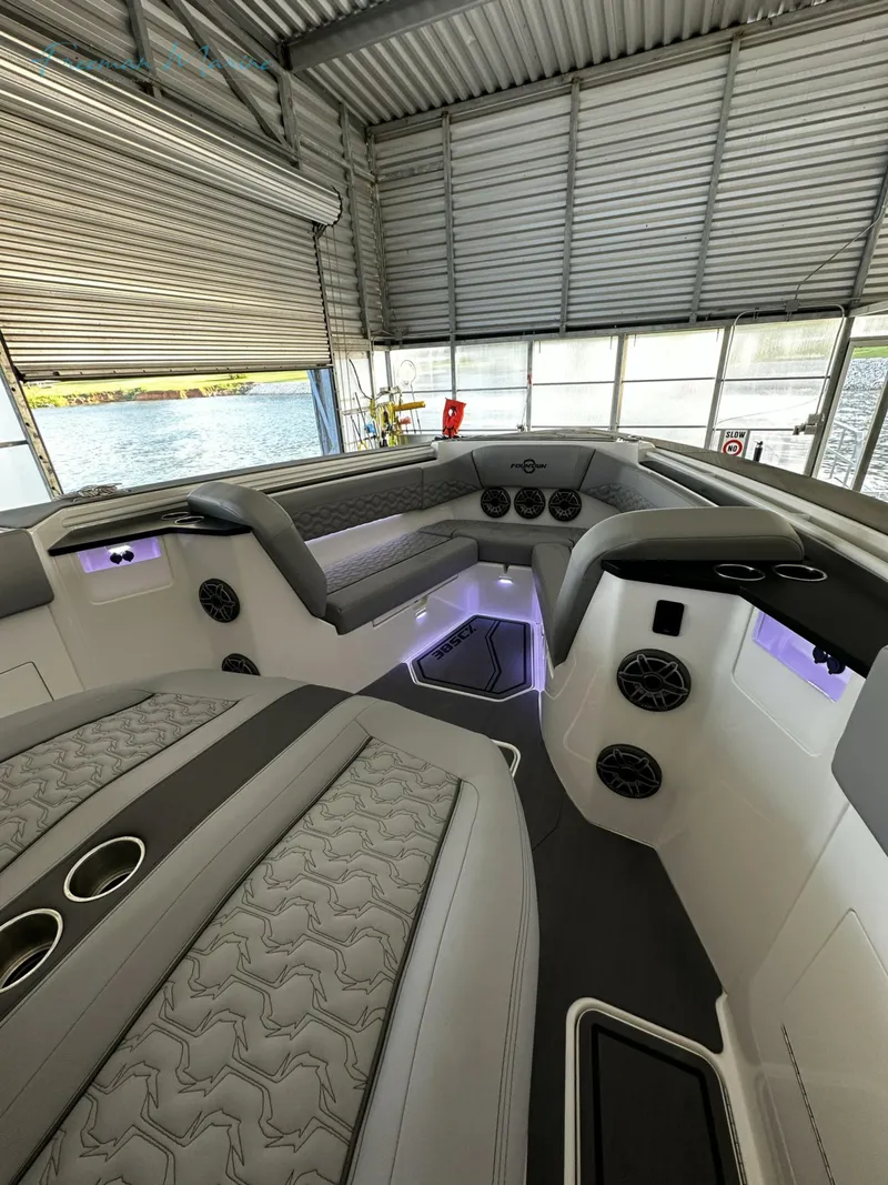 Slide: The Image of 2023 Fountain 38 SCX boat interior with modern seating and ambient lighting. - 9
