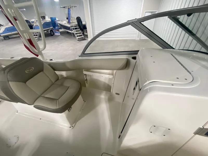 Slide: The Image of 2024 Key West 239 DFS boat interior with seating and storage compartments. - 18