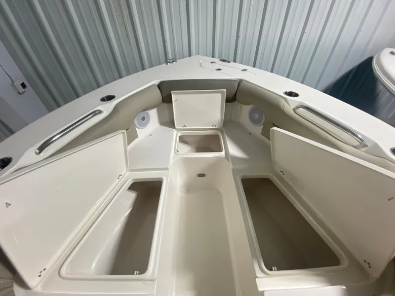 Slide: The Image of 2024 Key West 239 DFS boat bow storage compartments and seating area. - 26
