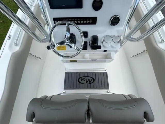 Slide: The Image of 2024 Key West 239 FS boat console with steering wheel and controls. - 15