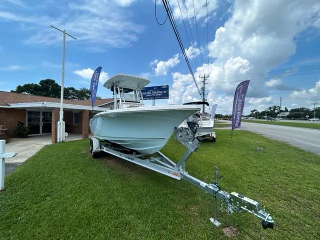 Slide: The Image of 2024 Key West 239 FS boat on trailer displayed outdoors. - 3