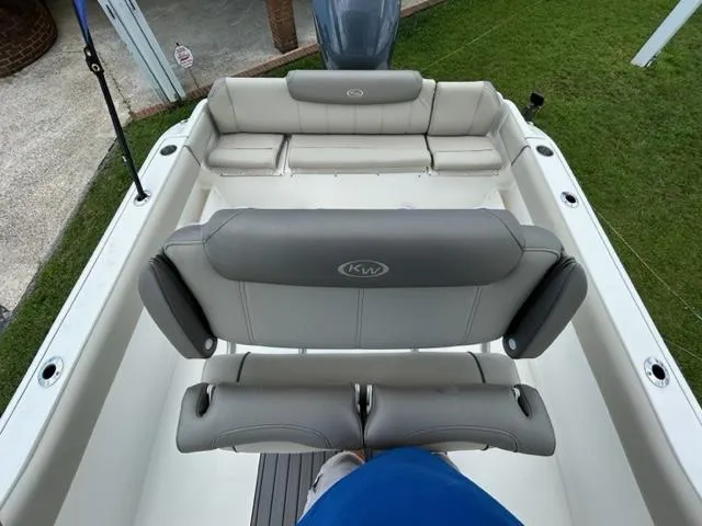 Slide: The Image of 2024 Key West 239 FS boat interior with cushioned seating and backrests. - 6