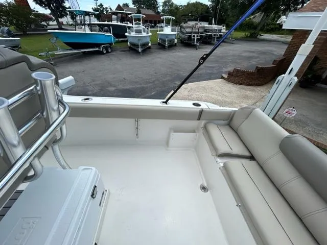 Slide: The Image of 2024 Key West 239 FS boat interior with seating and rod holders. - 9
