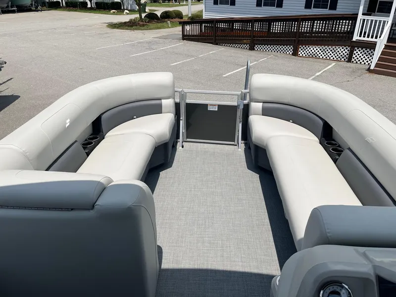 Slide: The Image of 2024 Starcraft LX22 F pontoon boat with spacious seating and modern design. - 12