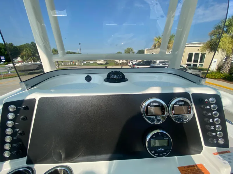 Slide: The Image of Dashboard of 2024 Robalo 226 Cayman boat with gauges and controls. - 15