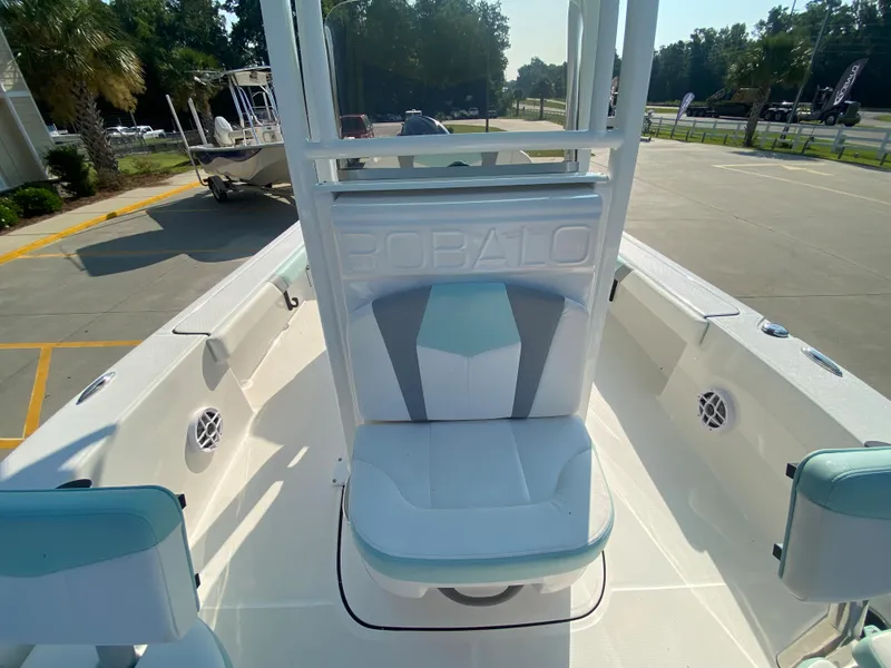 Slide: The Image of 2024 Robalo 226 Cayman boat interior with seating and console. - 19