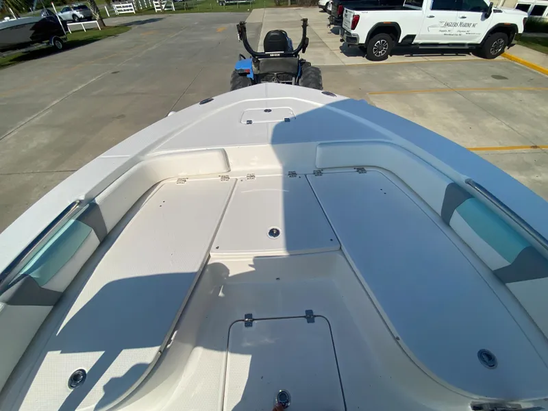 Slide: The Image of 2024 Robalo 226 Cayman boat deck with storage compartments. - 22