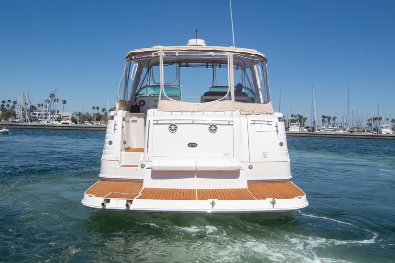 Slide: The Image of 2008 Rinker 400 Express Cruiser on water, rear view. - 23