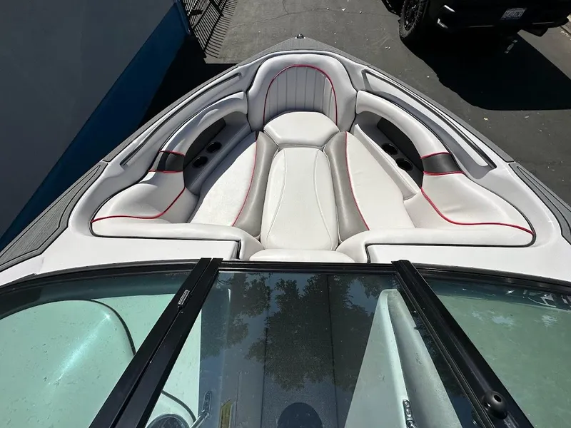 Slide: The Image of 2024 Sanger V237 S boat interior with white and red-trimmed seating. - 13