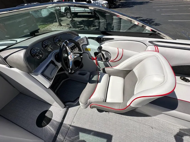 Slide: The Image of 2024 Sanger V237 S boat cockpit with modern dashboard and comfortable seating. - 16
