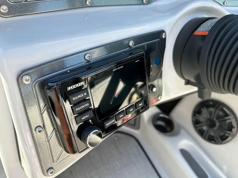 Slide: The Image of Close-up of the 2024 Sanger V237 S dashboard with Kicker audio system. - 19