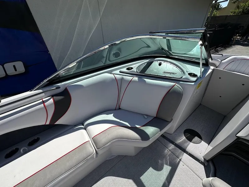 Slide: The Image of 2024 Sanger V237 S boat interior with white and gray seating, red accents. - 20
