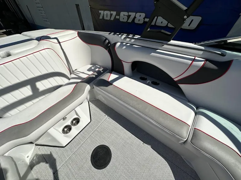 Slide: The Image of 2024 Sanger V237 S boat interior with white and gray seating, red accents. - 22