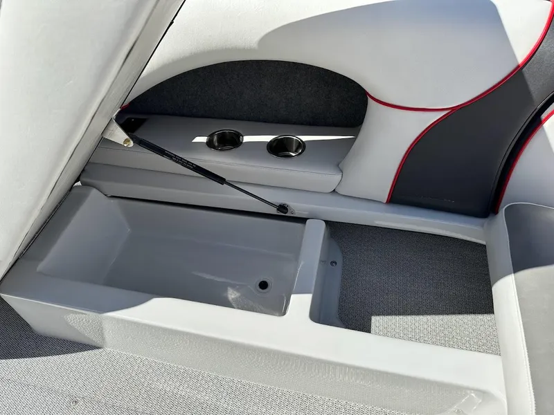 Slide: The Image of 2024 Sanger V237 S boat interior storage compartment with cup holders. - 24