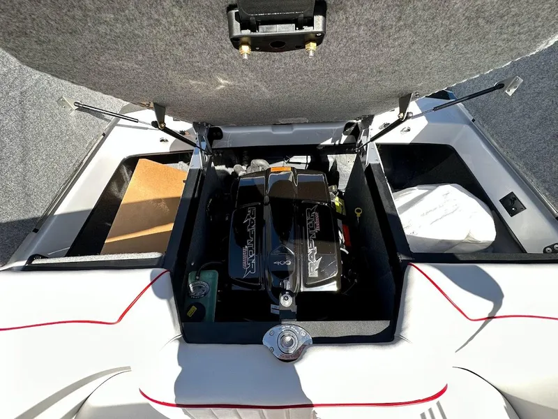 Slide: The Image of 2024 Sanger V237 S boat engine compartment with open hatch. - 29