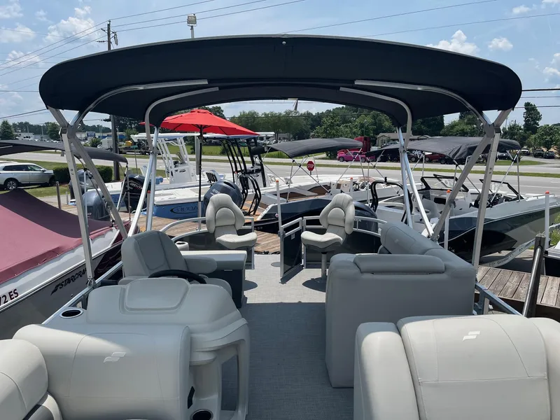 Slide: The Image of 2024 Starcraft LX22 F pontoon boat with spacious seating and canopy. - 13