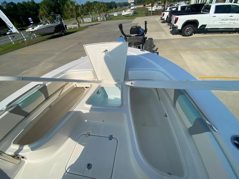 Slide: The Image of 2024 Robalo 226 Cayman boat interior with open storage compartments. - 24