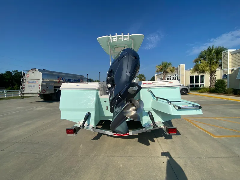 Slide: The Image of 2024 Robalo 226 Cayman boat rear view with outboard motor. - 3
