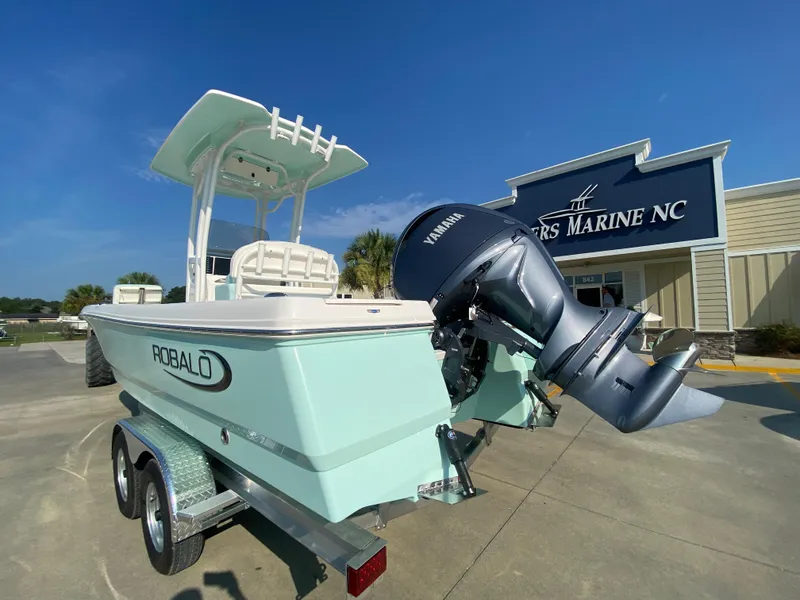 Slide: The Image of 2024 Robalo 226 Cayman boat with Yamaha outboard motor at dealership. - 4