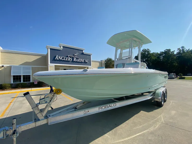 Slide: The Image of 2024 Robalo 226 Cayman boat on trailer at Anglers Marine NC dealership. - 5