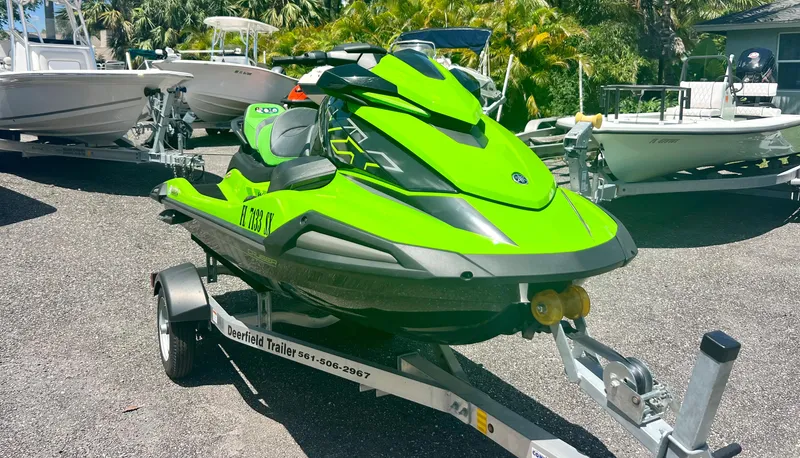 Slide: The Image of 2021 Yamaha WaveRunner VX Cruiser in bright green on a trailer. - 2
