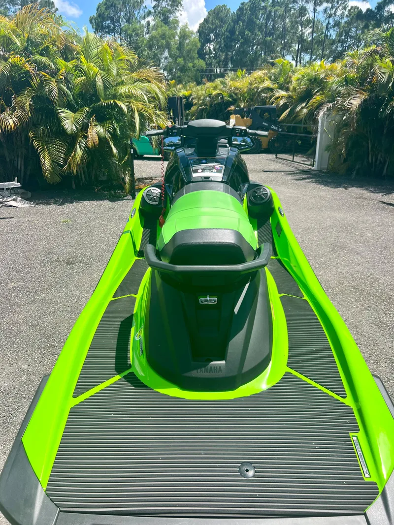 Slide: The Image of 2021 Yamaha WaveRunner VX Cruiser in vibrant green, parked outdoors. - 9
