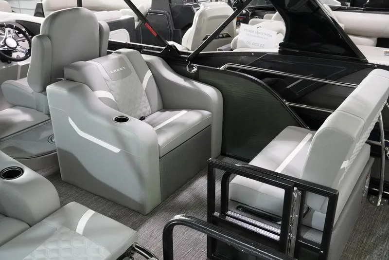 Slide: The Image of 2024 Crest Classic Platinum 240 SLRC pontoon boat interior with luxurious gray seating. - 12