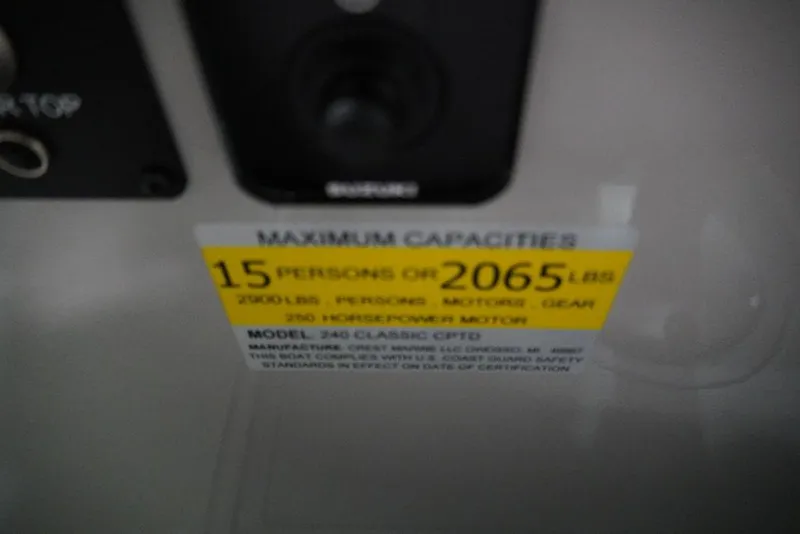 Slide: The Image of 2024 Crest Classic Platinum 240 SLRC capacity label: 15 persons or 2065 lbs, 250 horsepower motor. - 13