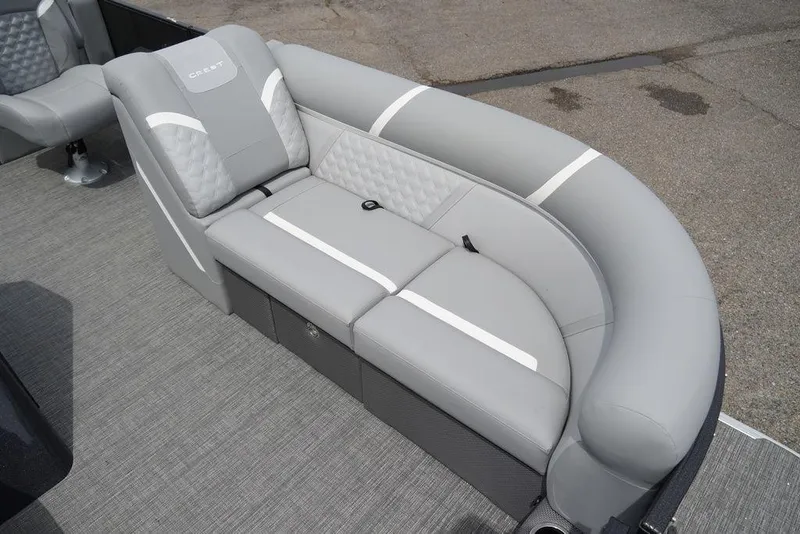 Slide: The Image of 2024 Crest Classic DLX 220 SLRC boat with luxurious gray seating. - 4
